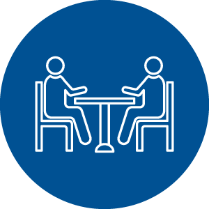 Graphic of two people sitting at a table.